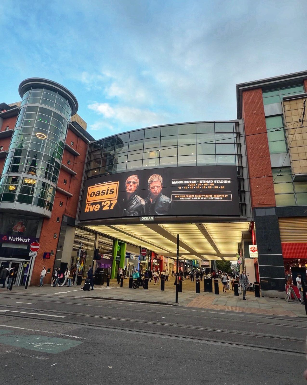 Oasis Live '27 billboard on Market Street