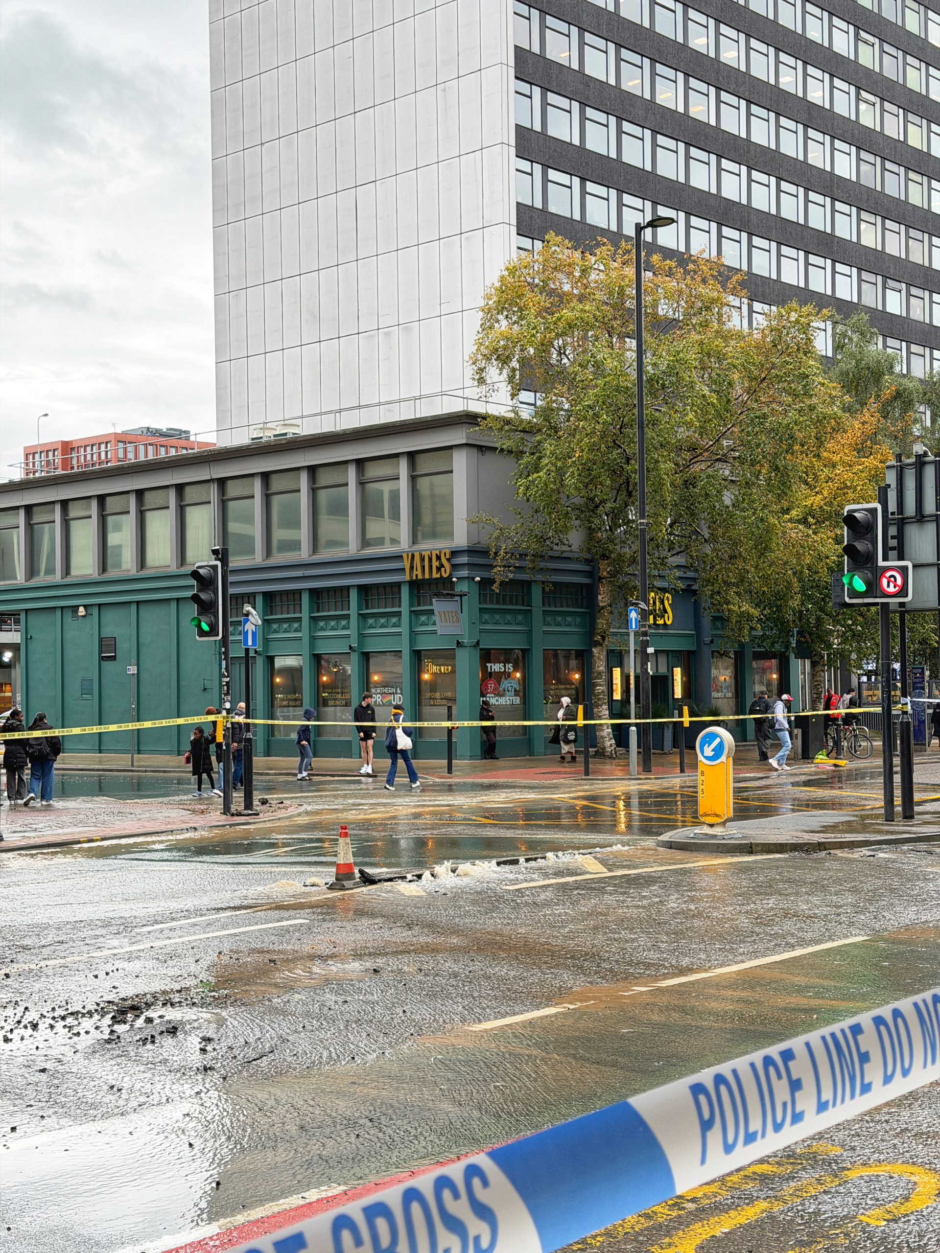 Significant disruption in Manchester city centre as water pours down Portland Street